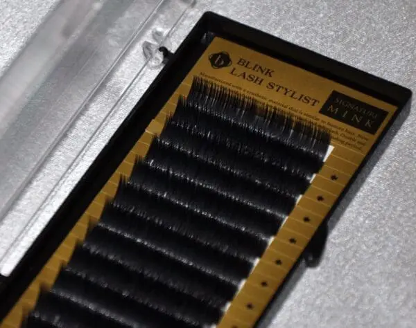 A close up of some black lashes in a box