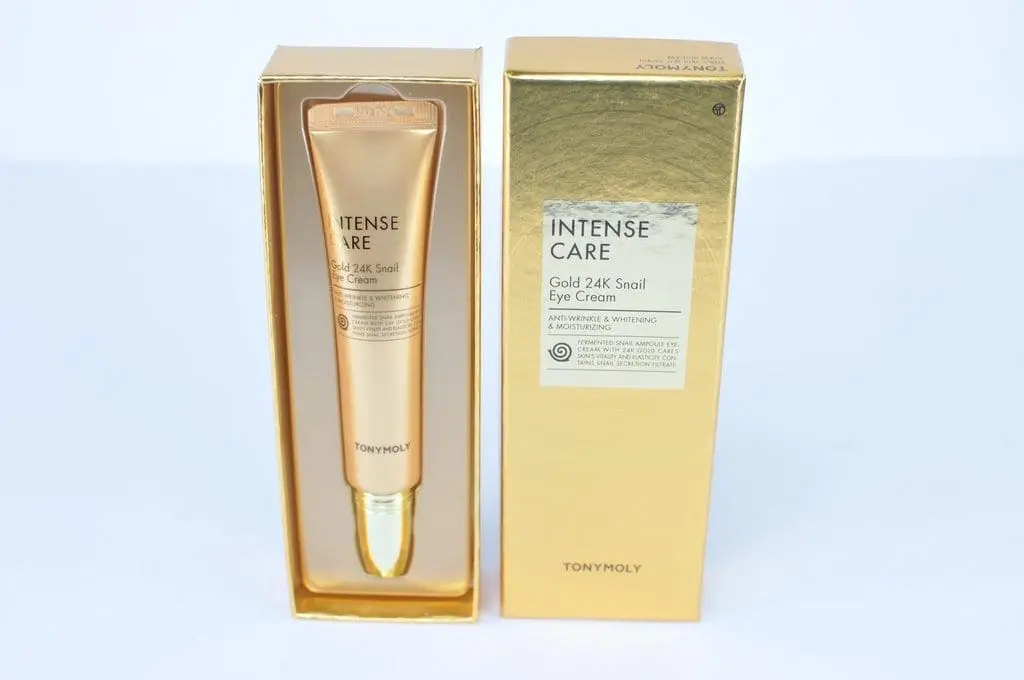 A gold box with a tube of intense care eye cream in it.