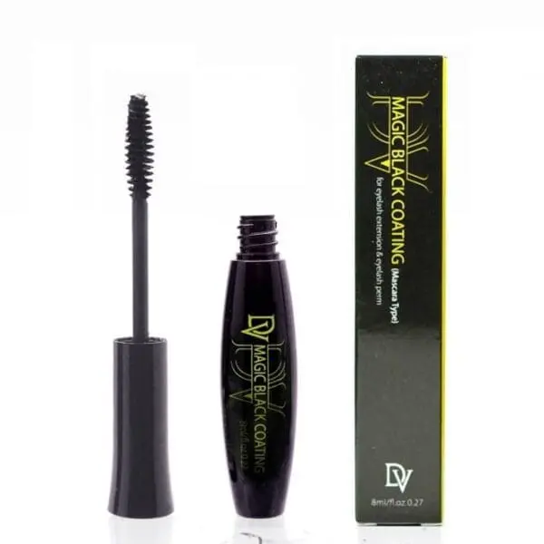 A black tube of mascara next to a box.