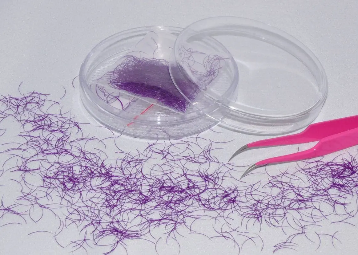 A plastic container with purple hair in it