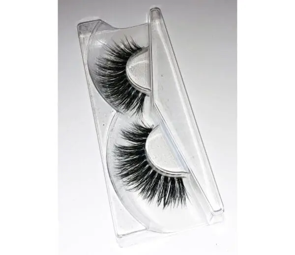 A pair of fake eyelashes in a clear case.