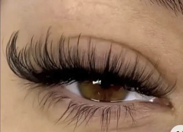 A close up of the eye with long eyelashes