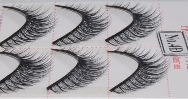 A close up of four pairs of fake eyelashes