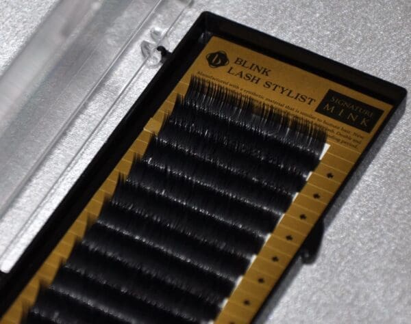 A close up of some black lashes in a box