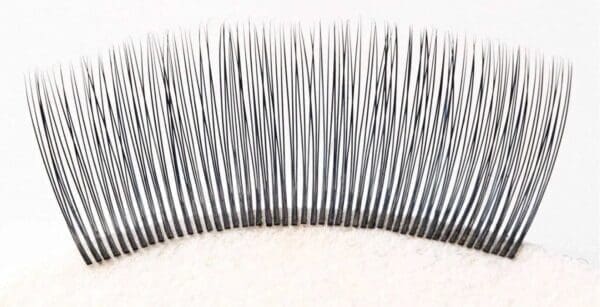 A close up of the bottom part of a false eyelash