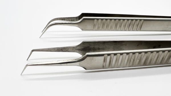 Three pairs of tweezers are shown side by side.