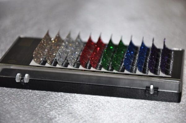 A row of different colored nails sitting on top of a table.