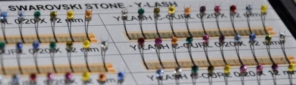 A close up of some pins on the side of a sheet