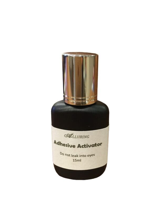 A bottle of perfume with the label " adhesion activator ".