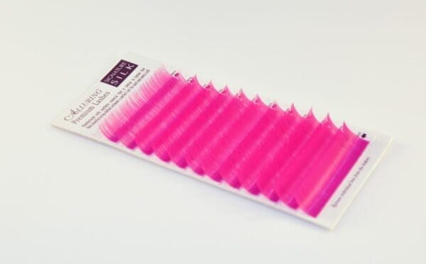 A pink strip of colored individual lashes