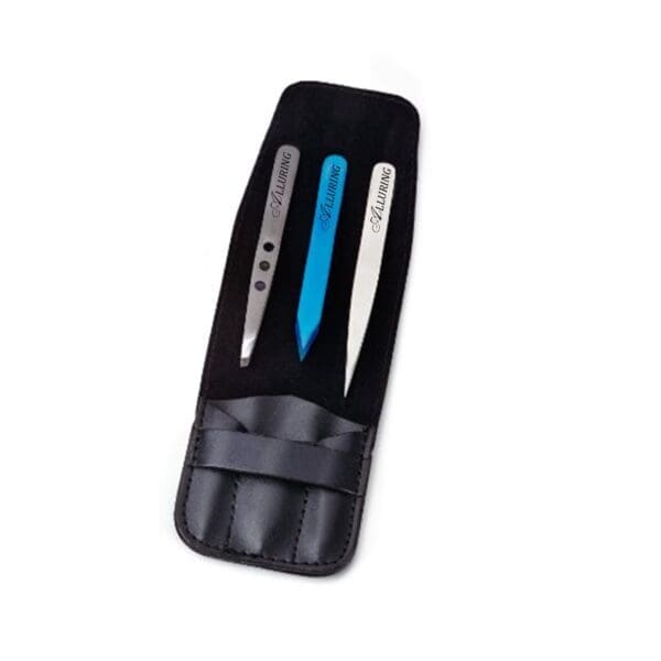 A black case with three different colored tweezers in it.