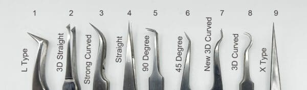 A number of different types of tweezers on top of each other.