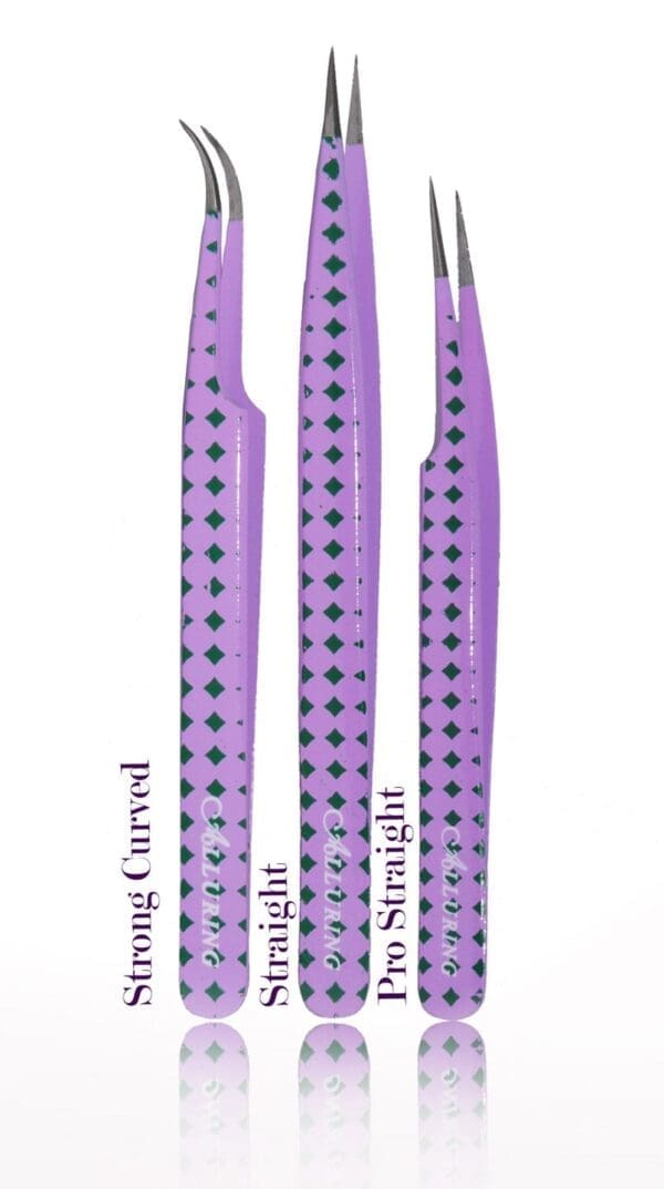 A set of three purple tweezers with black polka dots.