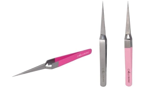 A pair of scissors with pink handles and a silver handle.