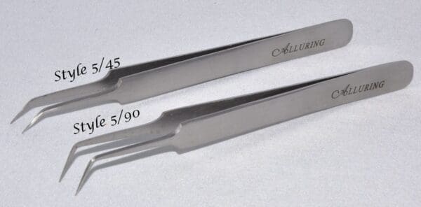 A pair of tweezers with the numbers 5 and 9 0 on them.