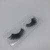 A pair of fake eyelashes in a package.
