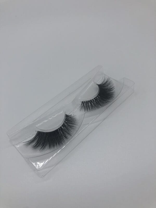 A pair of fake eyelashes in a package.